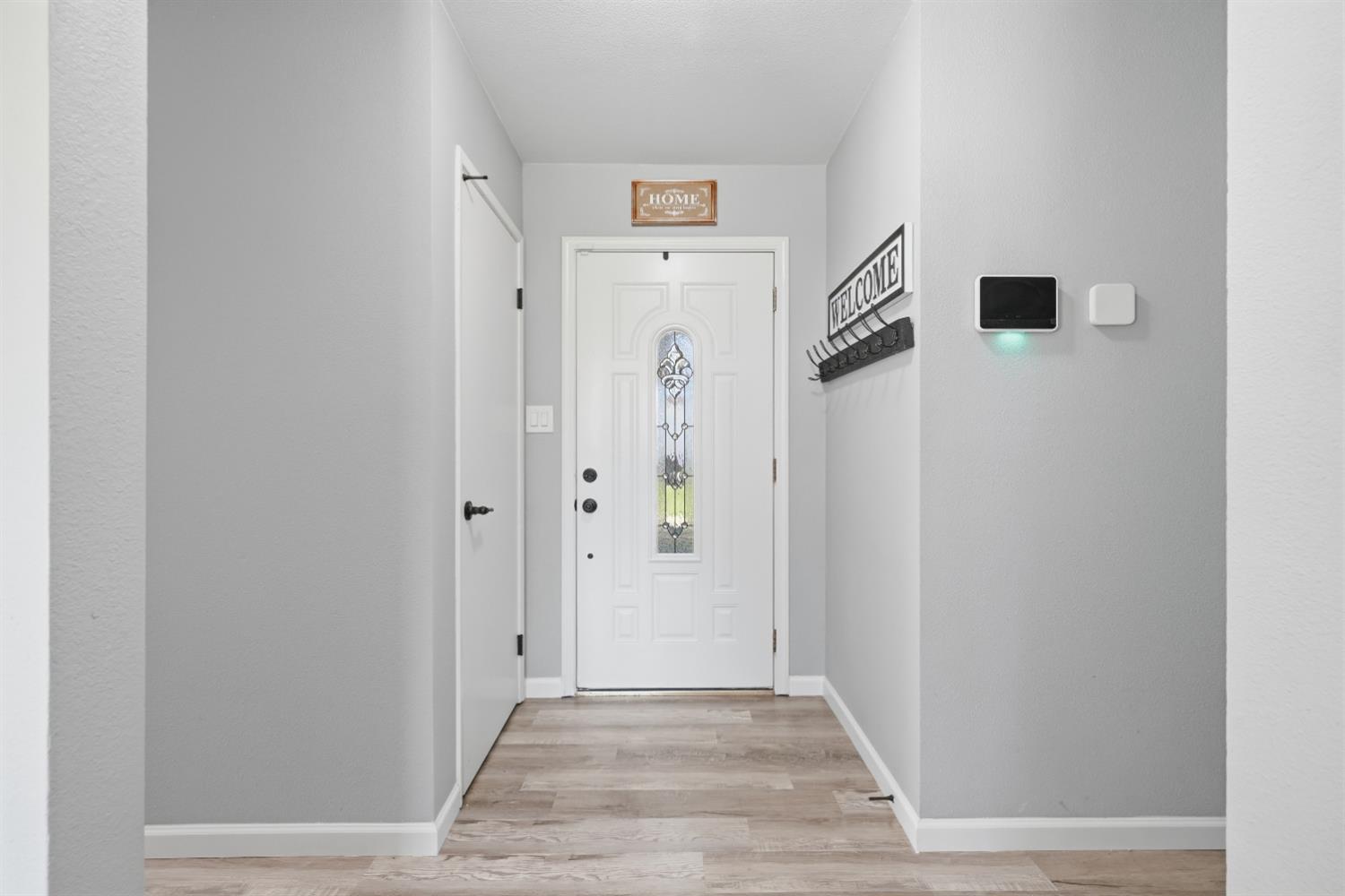 4609 Volo Mine Road Diamond Springs, CA 95619 - Photo 5 of 29 a view of a hallway with wooden floor
