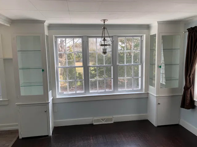 a room with window and furniture