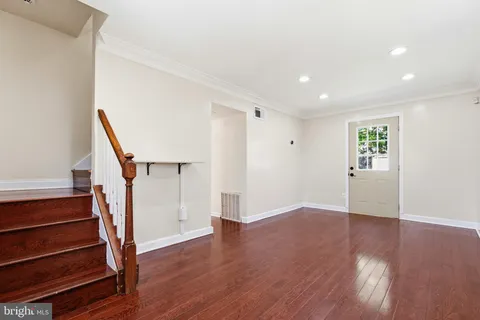 a view of entryway with wooden floor