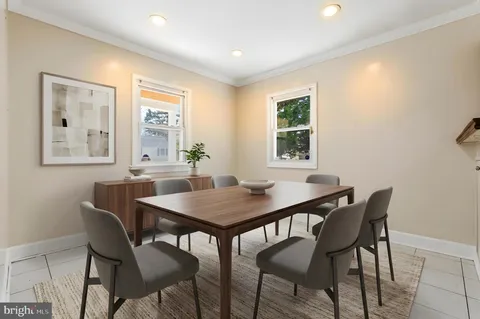 a view of a dining room with furniture and window