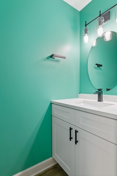 26 East 14th Place, Unit 15W Chicago, IL 60605 - Photo 19 of 36 a bathroom with a sink and mirror