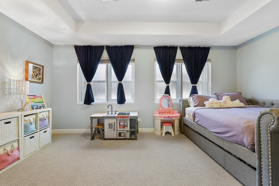 26 East 14th Place, Unit 15W Chicago, IL 60605 - Photo 22 of 36 a bedroom with bed and a large window