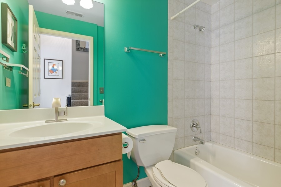 26 East 14th Place, Unit 15W Chicago, IL 60605 - Photo 24 of 36 a bathroom with a sink toilet and shower