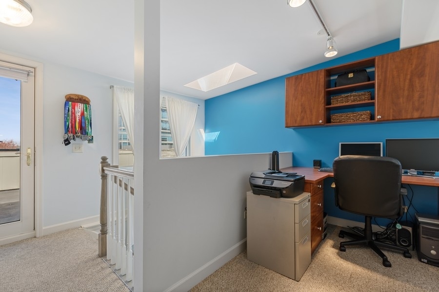 26 East 14th Place, Unit 15W Chicago, IL 60605 - Photo 31 of 36 a view of a workspace with furniture and a workspace