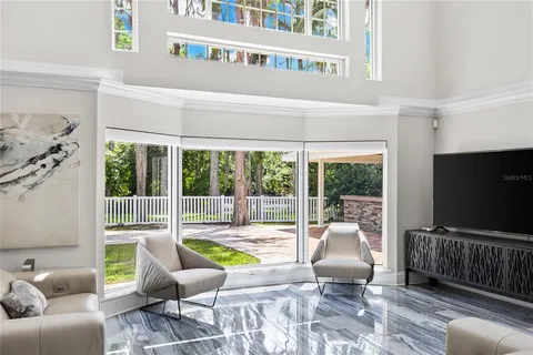 a living room with furniture and a garden