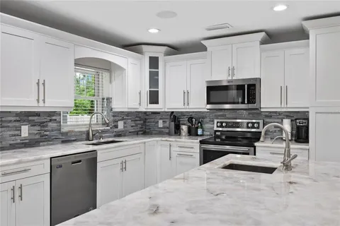 a living room with fireplace furniture and a flat screen tv