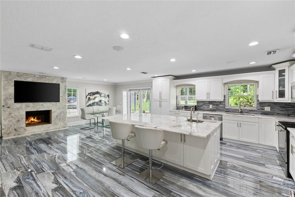 3663 Berger Road Lutz, FL 33548 - Photo 19 of 65 a living room with fireplace furniture and a flat screen tv