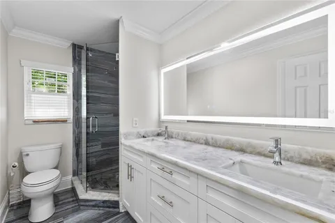 a view of a livingroom with wooden floor and a window