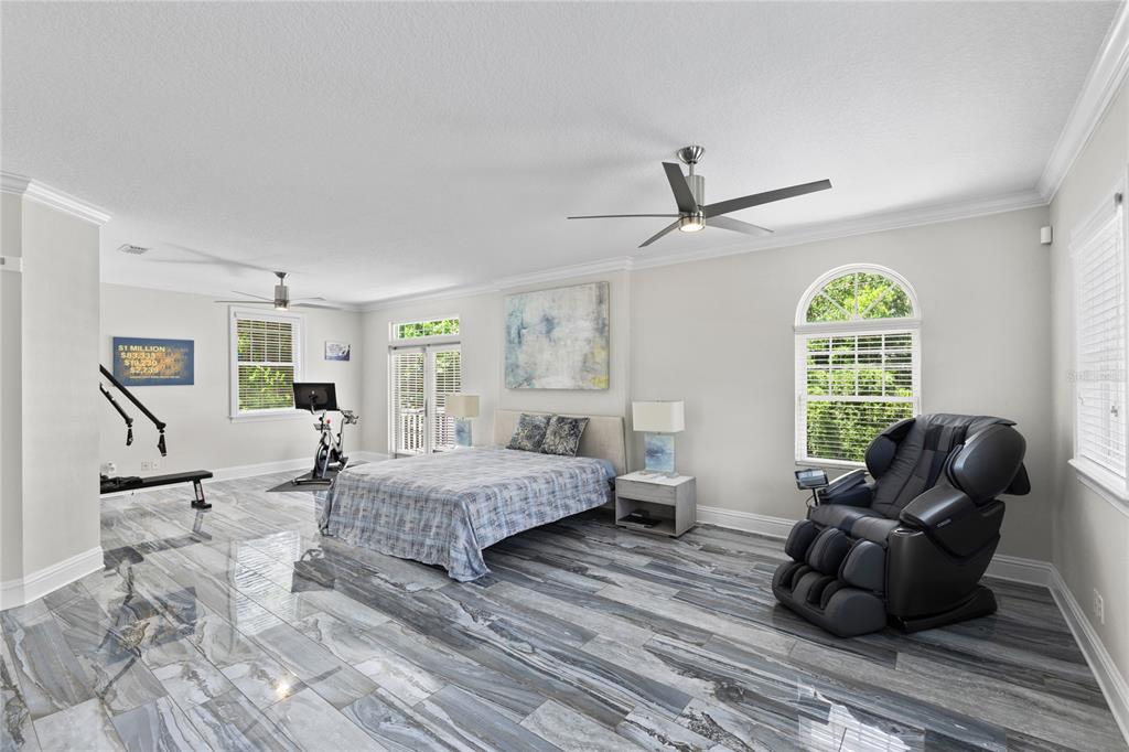 3663 Berger Road Lutz, FL 33548 - Photo 30 of 65 a living room with furniture large window and wooden floor