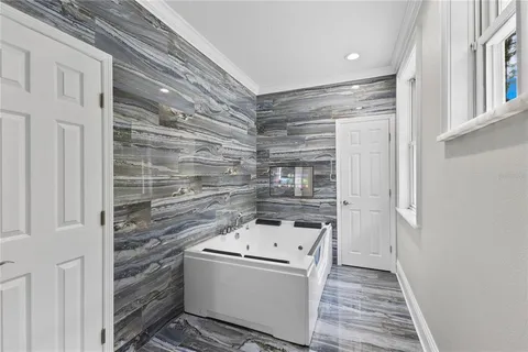 a view of a house with swimming pool porch and wooden floor