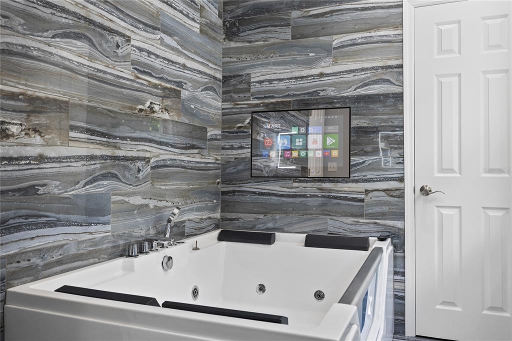 3663 Berger Road Lutz, FL 33548 - Photo 38 of 65 a bathroom with a sink and a shower