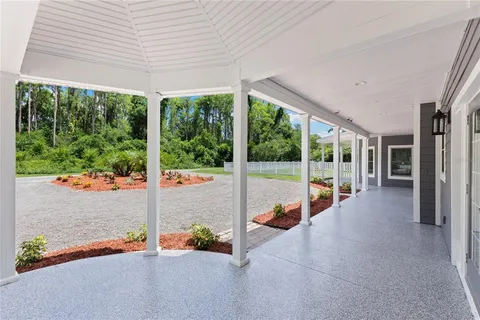 a front view of a house with a yard table and chairs