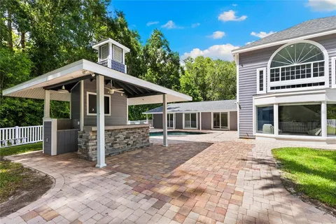an aerial view of a house with a yard