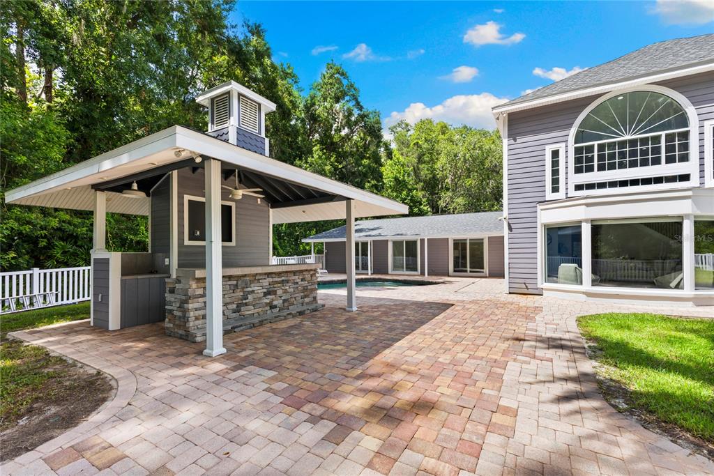 3663 Berger Road Lutz, FL 33548 - Photo 47 of 65 a front view of a house with garden