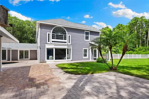 a view of a yard with a tree