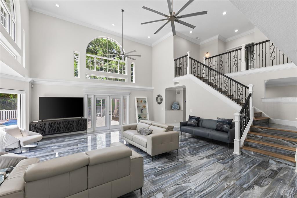 3663 Berger Road Lutz, FL 33548 - Photo 7 of 65 a living room with furniture fireplace and a large window