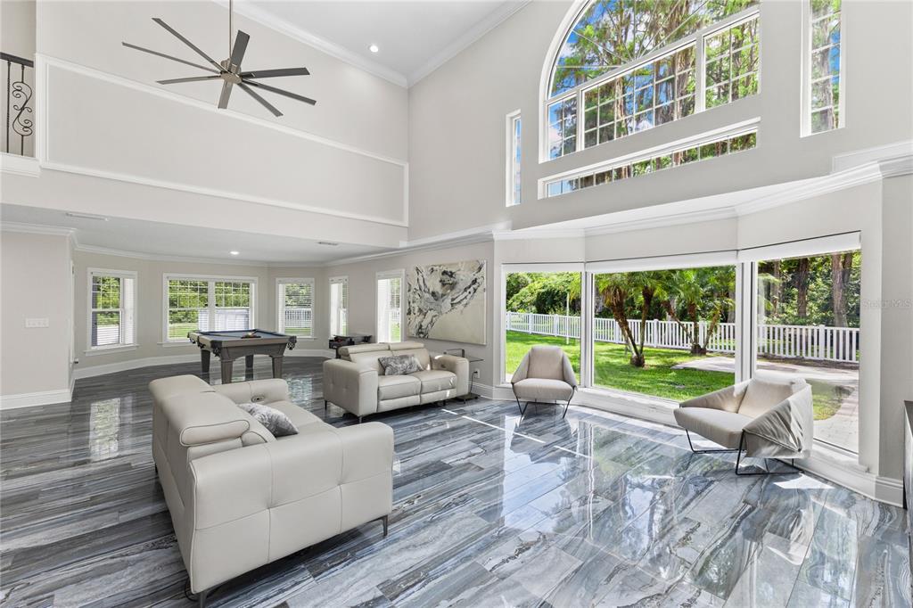 3663 Berger Road Lutz, FL 33548 - Photo 10 of 65 a living room with furniture and a large window