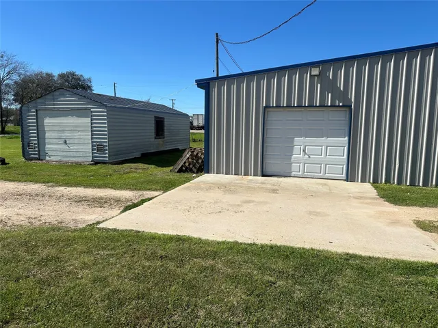 a view of a backyard of the house