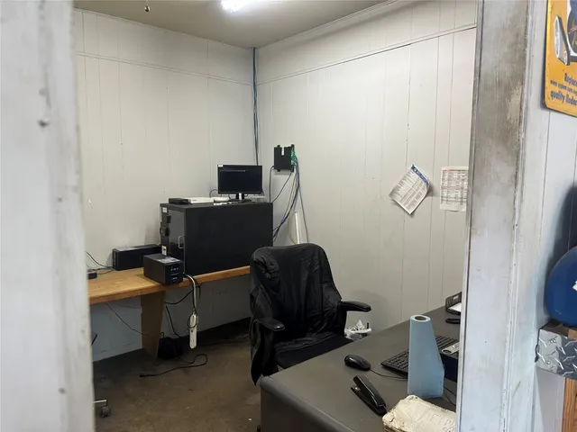 a view of workspace with wooden wall