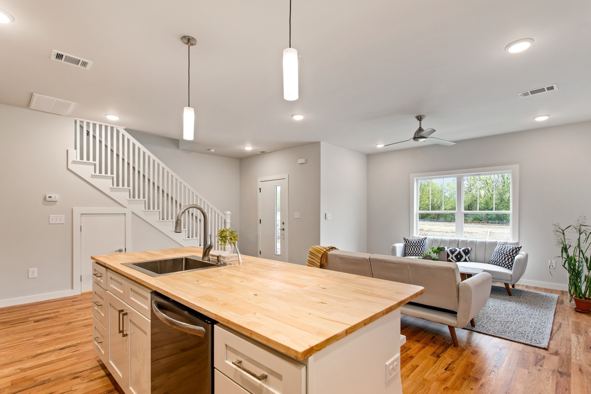 3625 Hydes Ferry Road Nashville, TN 37218 - Photo 6 of 17 a kitchen with a sink a counter top space and living room view