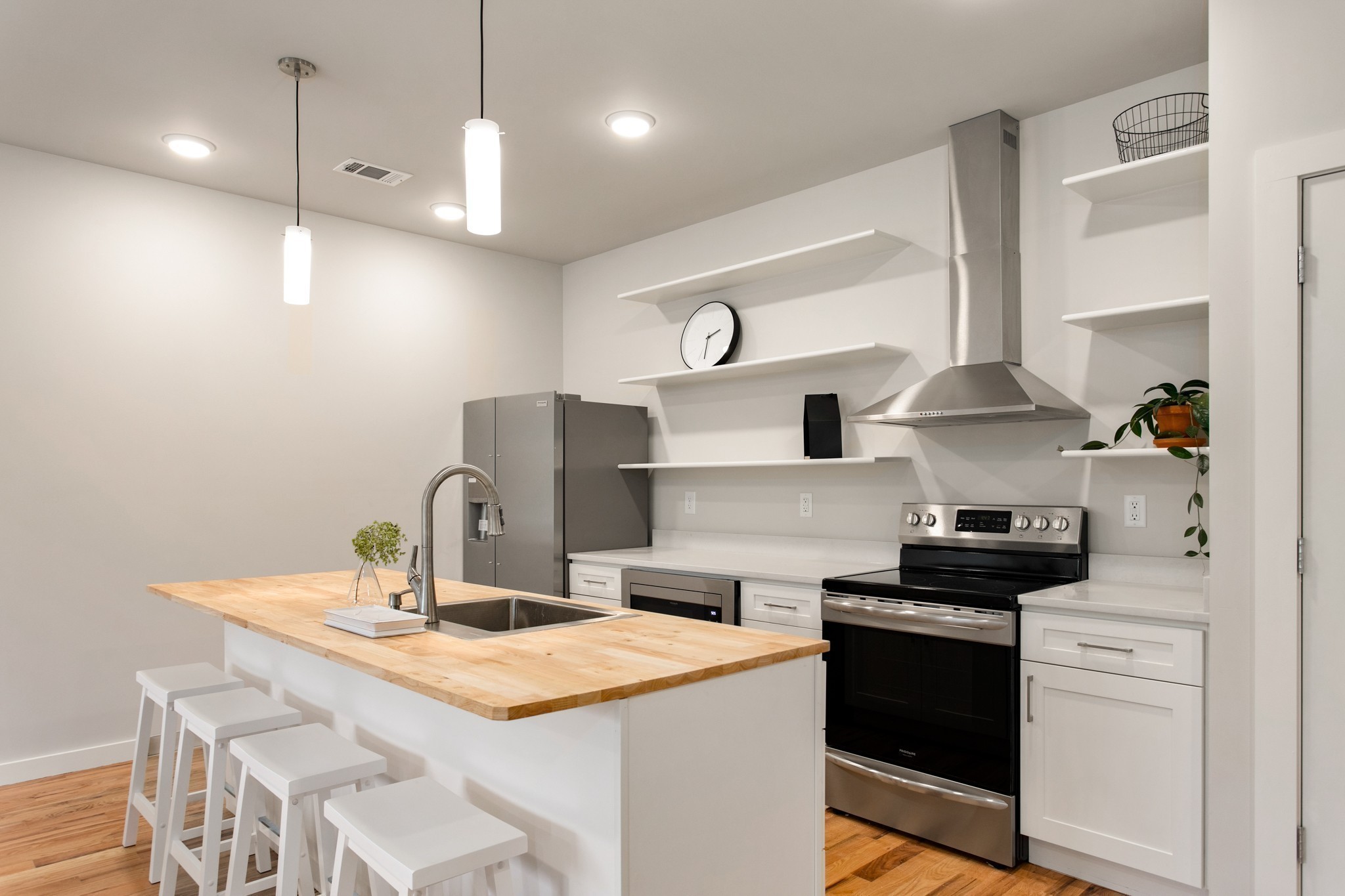 3625 Hydes Ferry Road Nashville, TN 37218 - Photo 7 of 17 a kitchen with a sink a stove and chairs
