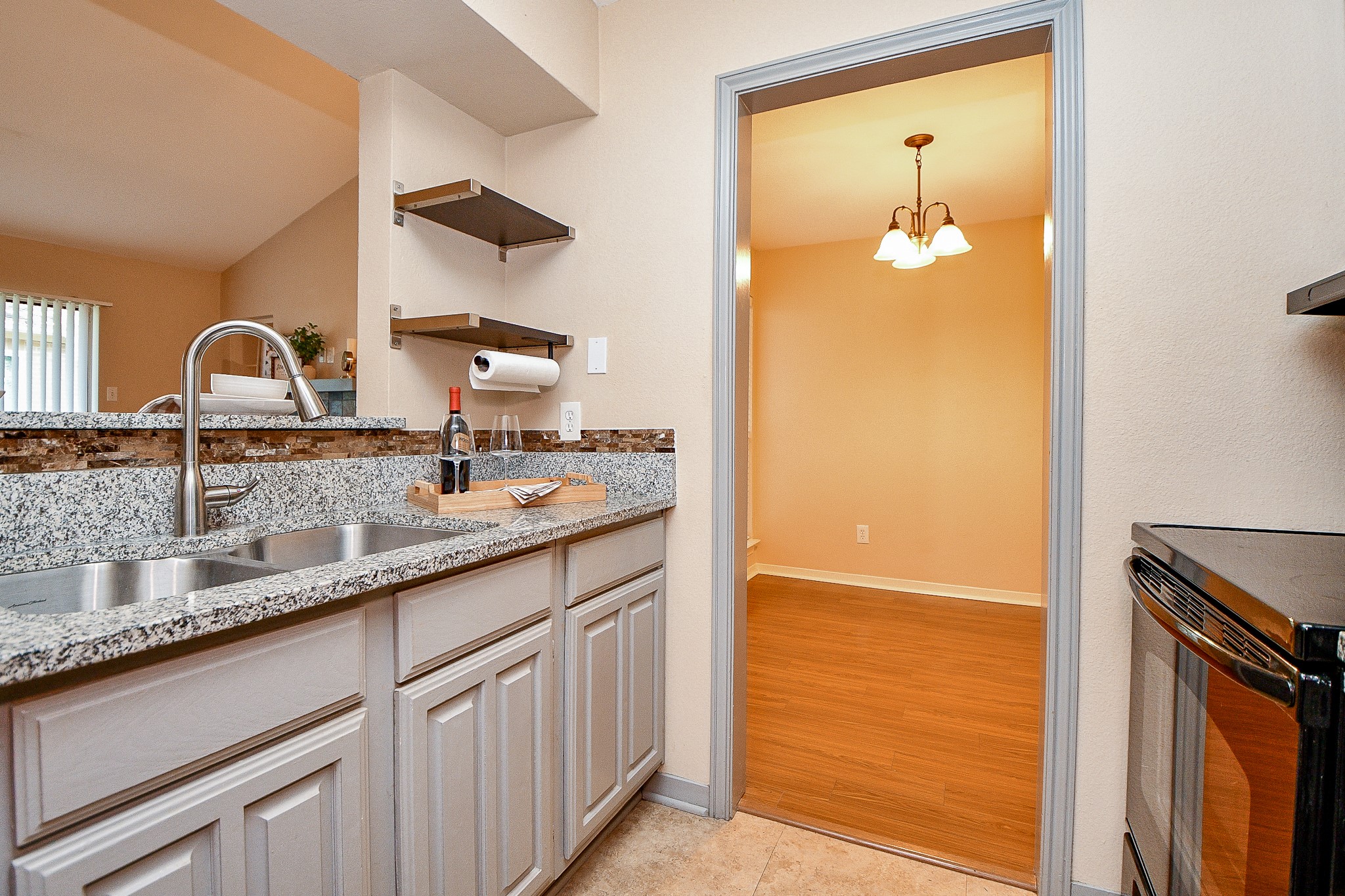 3500 Tangle Brush Drive, Unit 14 Spring, TX 77381 - Photo 16 of 33 a bathroom with a granite countertop sink and a mirror
