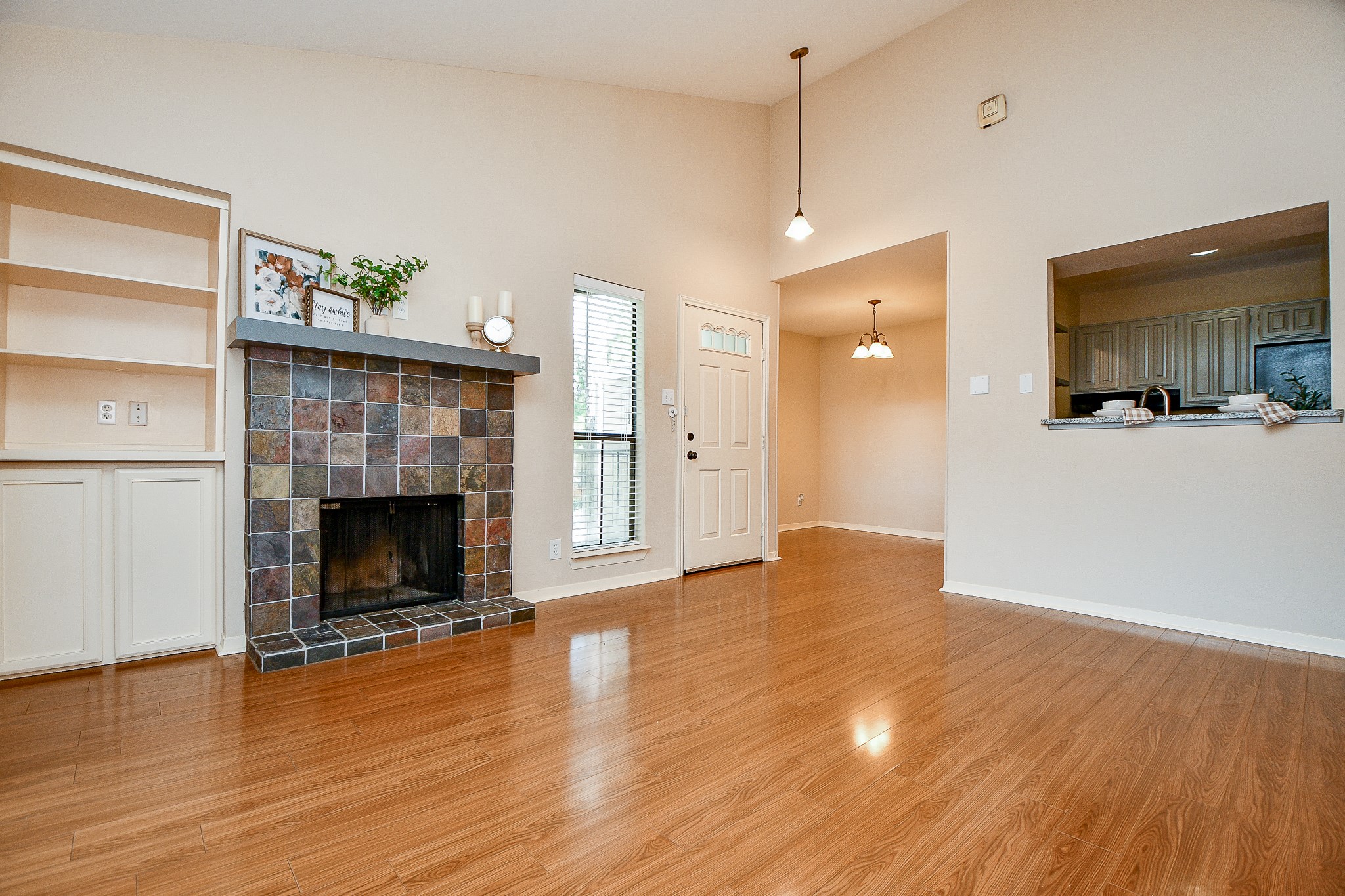 3500 Tangle Brush Drive, Unit 14 Spring, TX 77381 - Photo 18 of 33 a view of empty room with wooden floor and fireplace