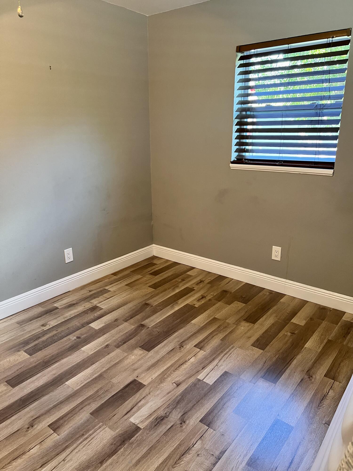 511 Northwest 3rd Street Delray Beach, FL 33444 - Photo 16 of 21 a view of a room with wooden floor and a window