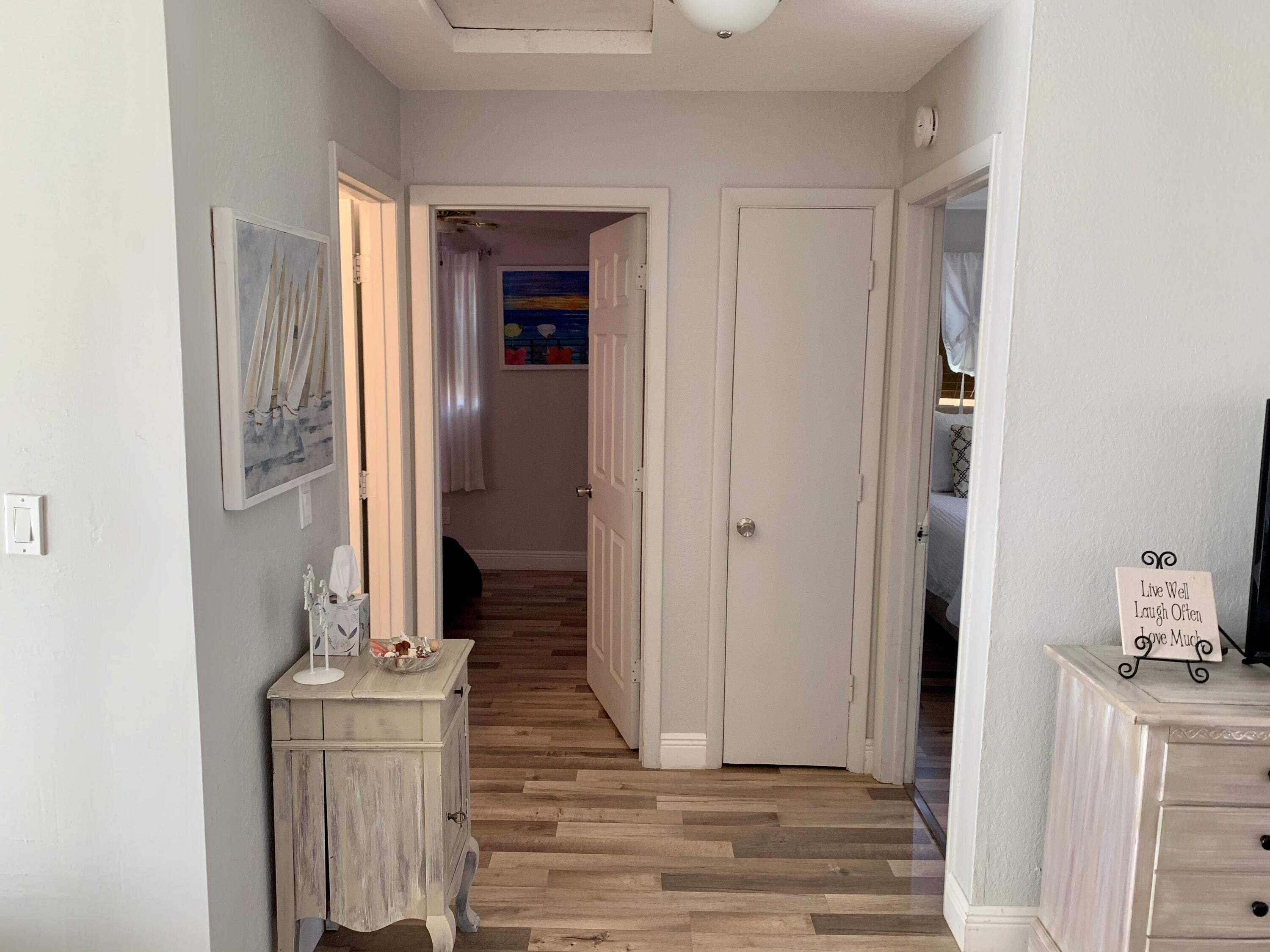 511 Northwest 3rd Street Delray Beach, FL 33444 - Photo 18 of 21 a view of a hallway with wooden floor and front door