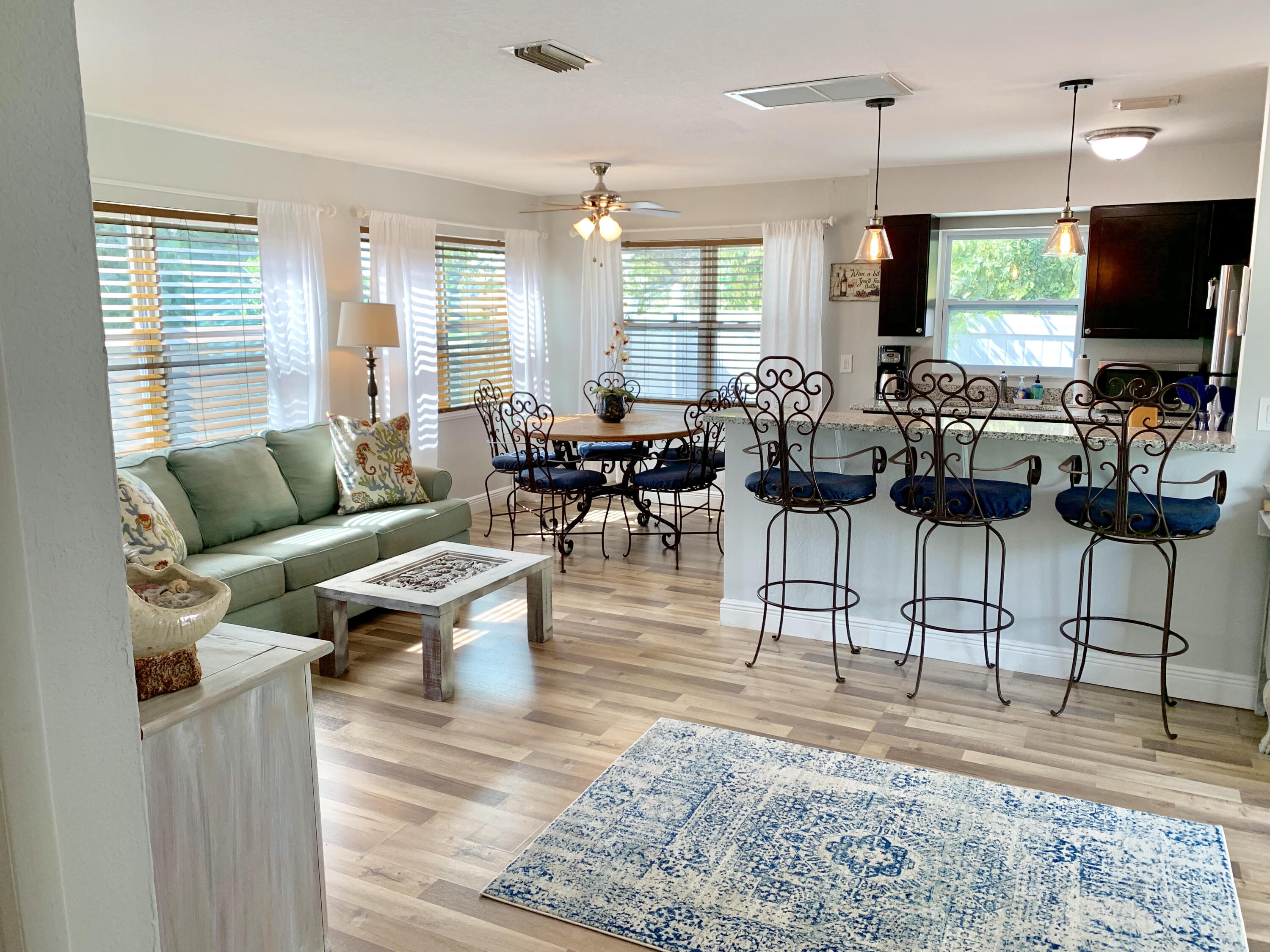511 Northwest 3rd Street Delray Beach, FL 33444 - Photo 7 of 21 a living room with lots of furniture and a flat screen tv