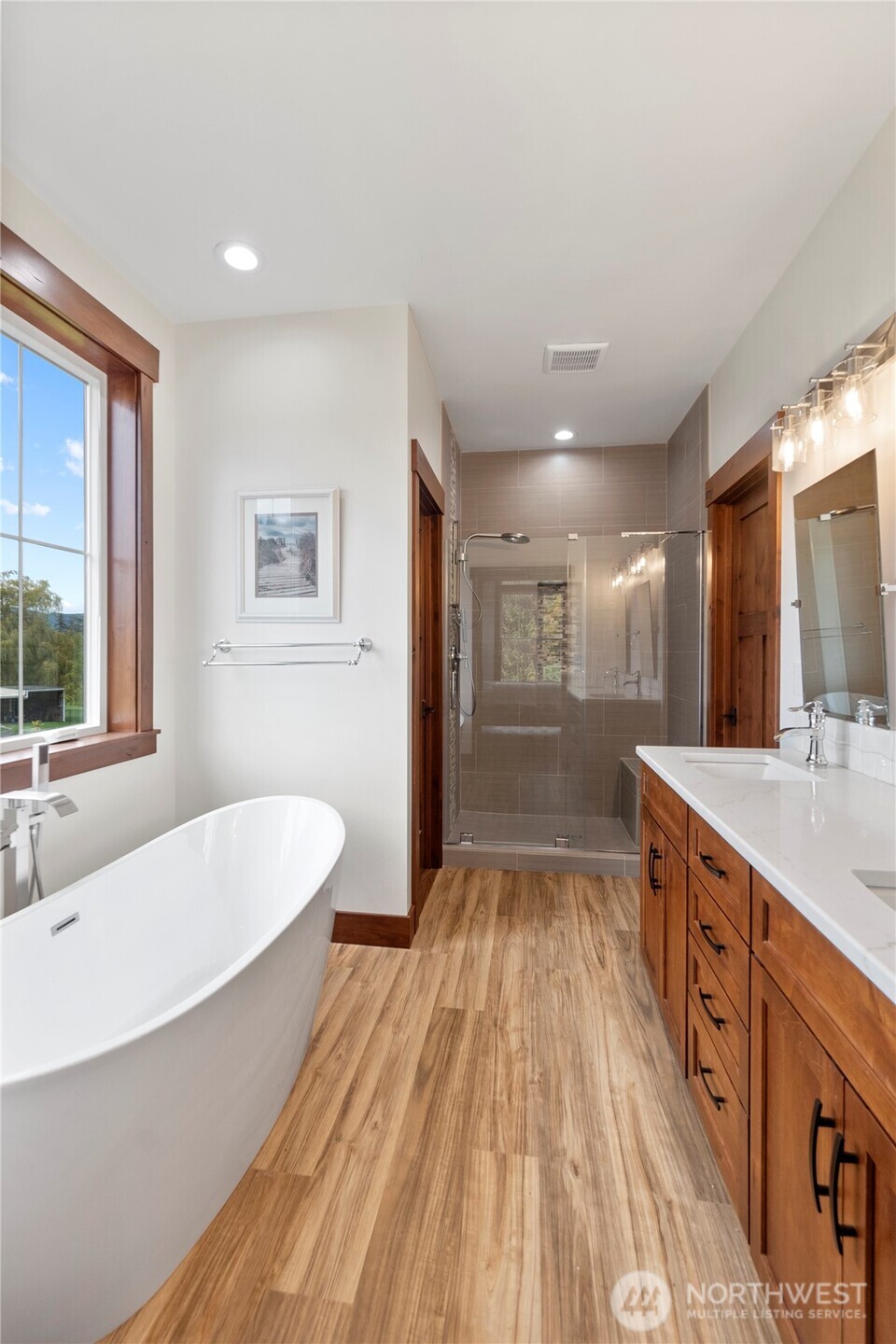 1851 Bloomhardt Road Raymond, WA 98577 - Photo 12 of 31 a spacious bathroom with a double vanity sink a mirror and a bathtub