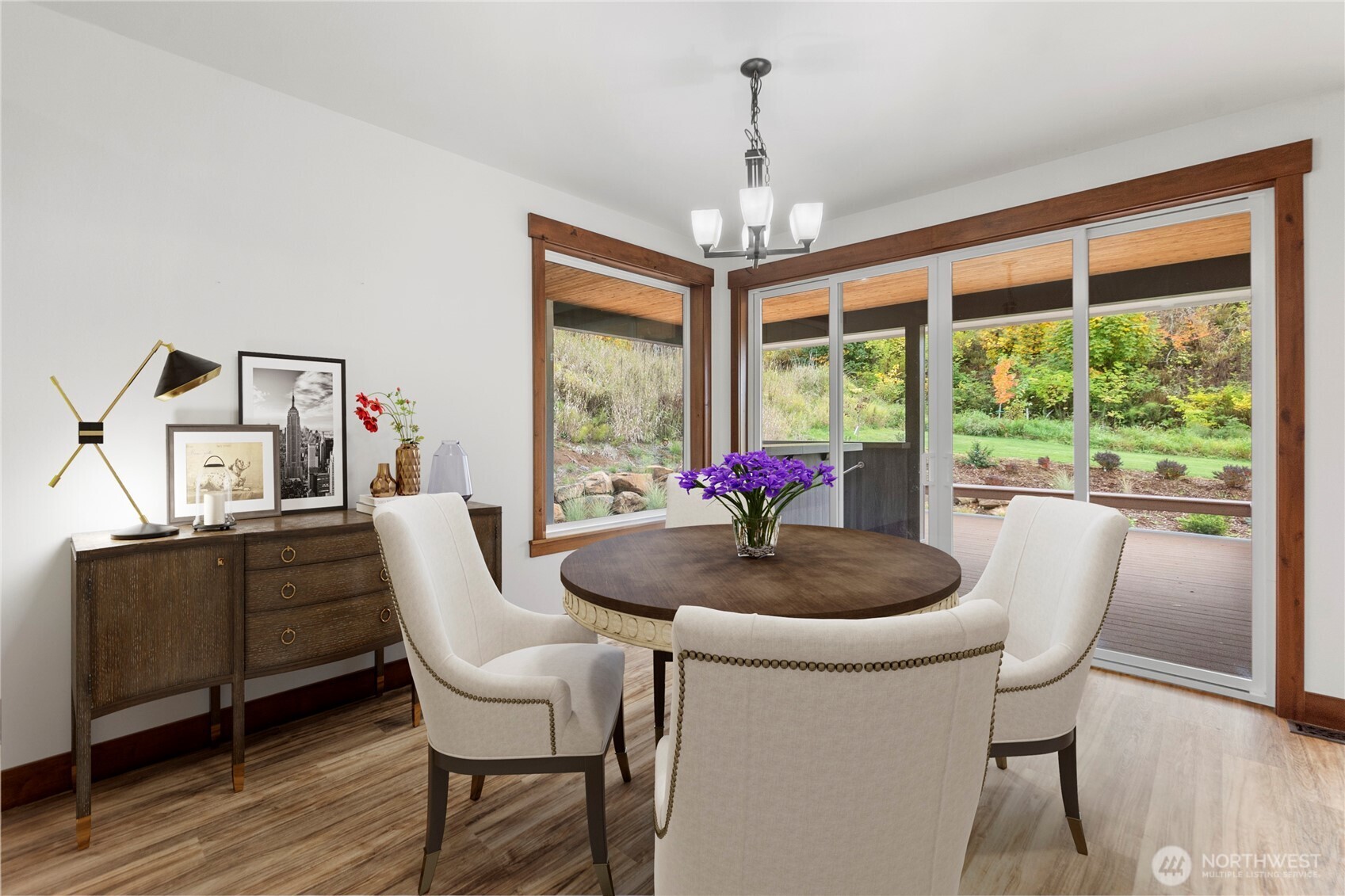 1851 Bloomhardt Road Raymond, WA 98577 - Photo 20 of 31 a dining room with furniture a chandelier and wooden floor