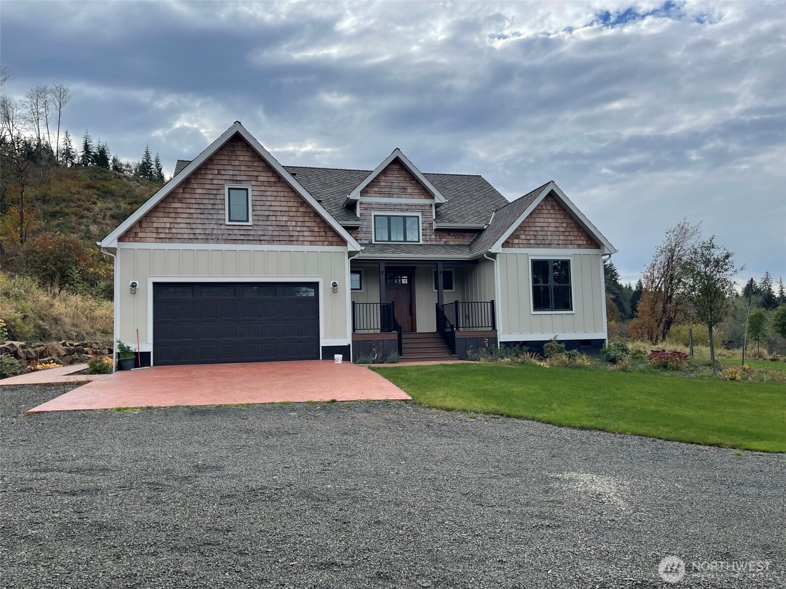 1851 Bloomhardt Road Raymond, WA 98577 - Photo 2 of 31 a front view of a house with a yard and garage