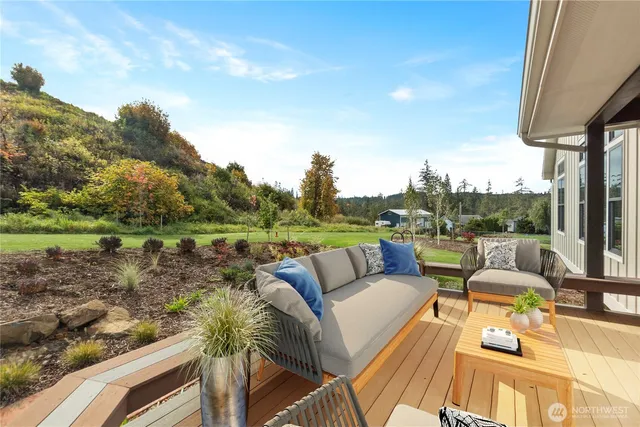 a view of a terrace with couches and pool