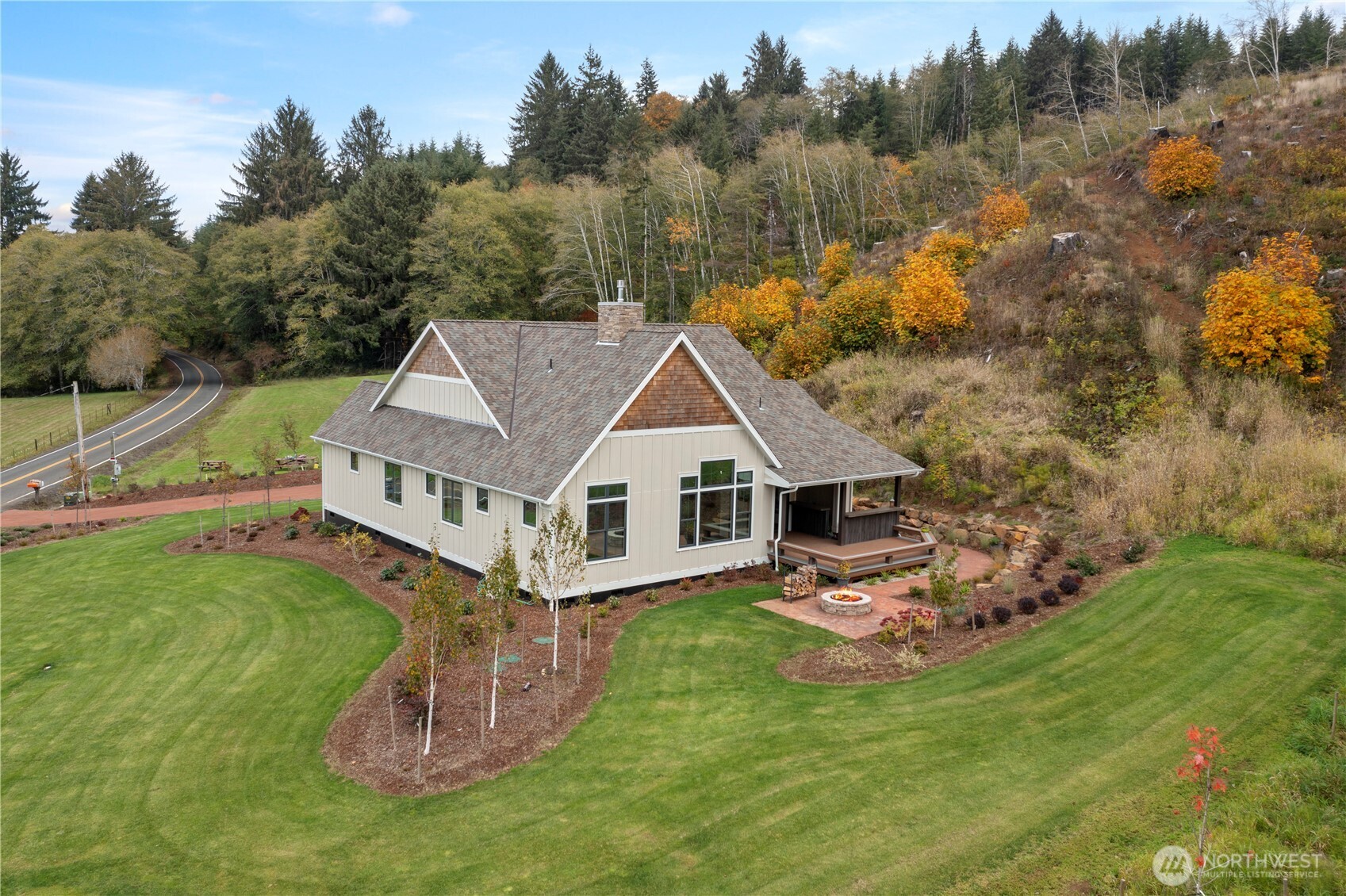 1851 Bloomhardt Road Raymond, WA 98577 - Photo 30 of 31 a aerial view of a house with a yard table and chairs