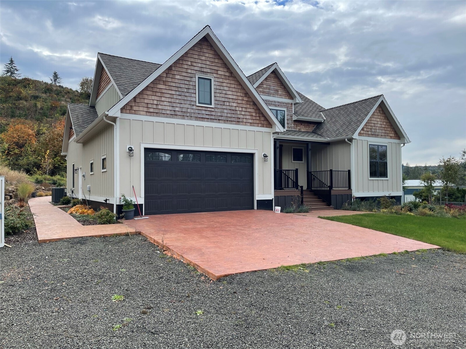 1851 Bloomhardt Road Raymond, WA 98577 - Photo 3 of 31 a front view of a house with a yard and garage