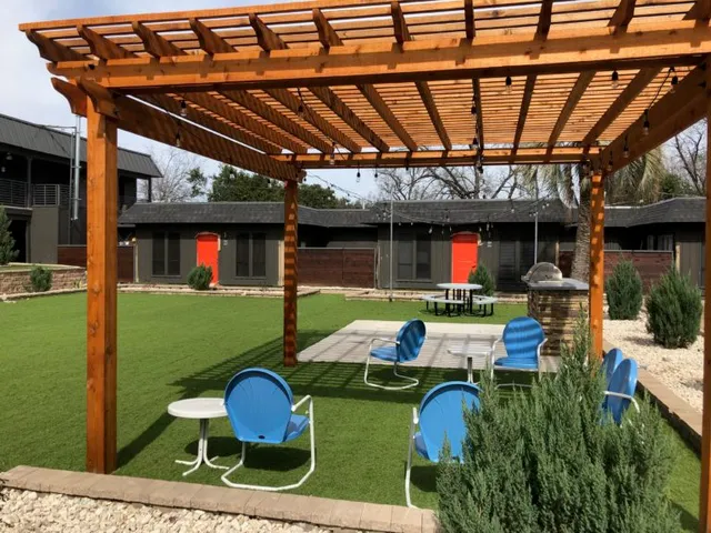 a patio with yard table and chairs