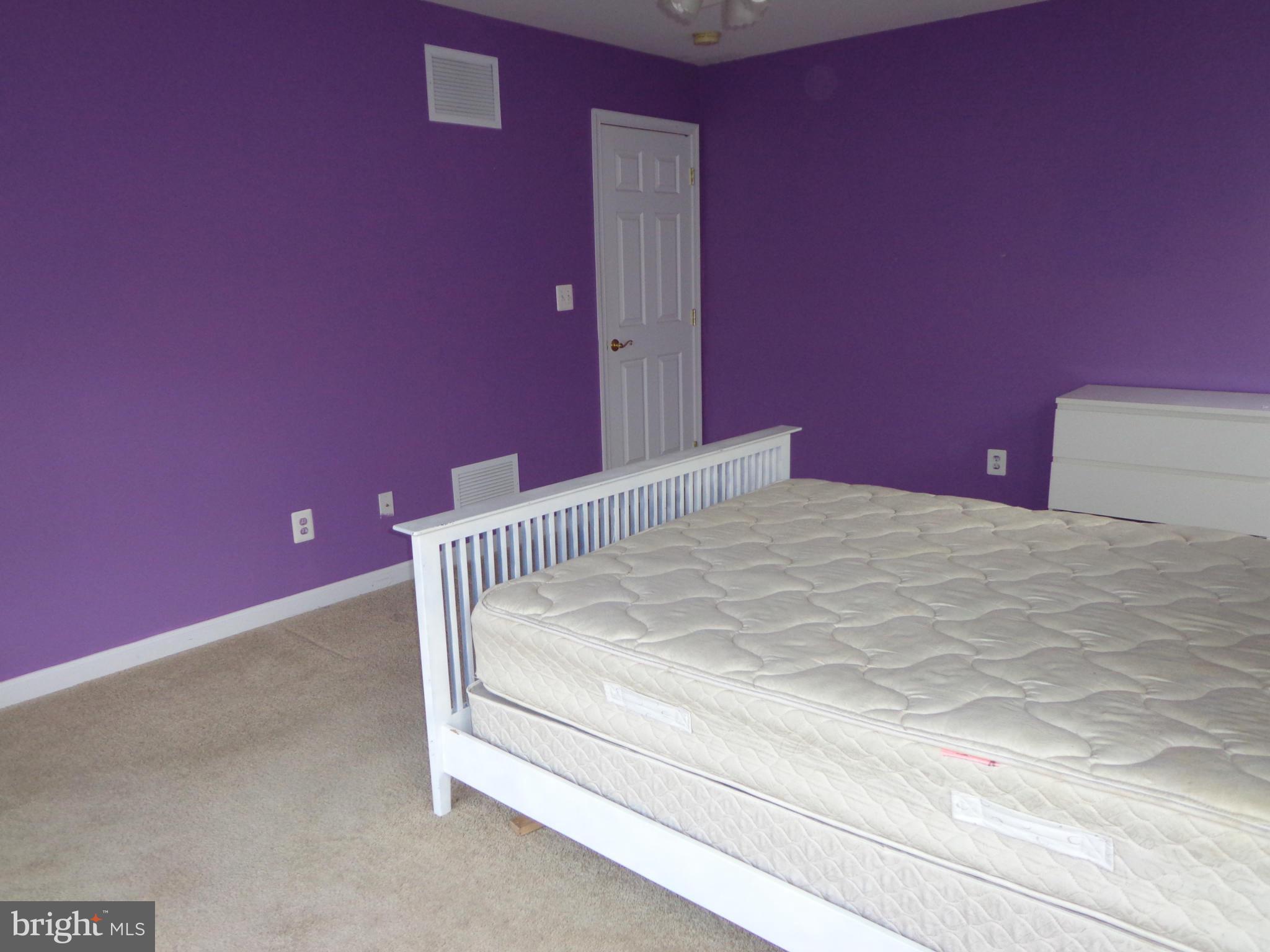 915 Oakdene Road Baltimore, MD 21220 - Photo 15 of 30 a bedroom with a bed and a mirror