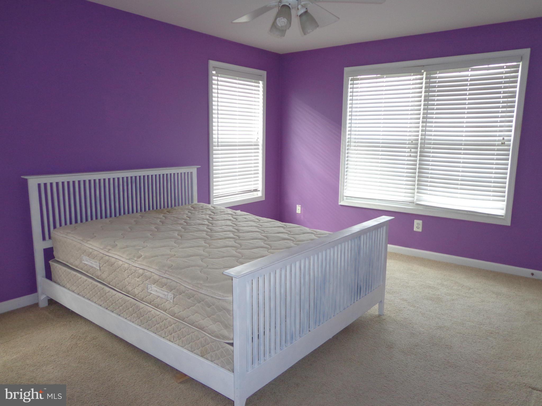 915 Oakdene Road Baltimore, MD 21220 - Photo 16 of 30 a bed sitting in a bedroom next to a window