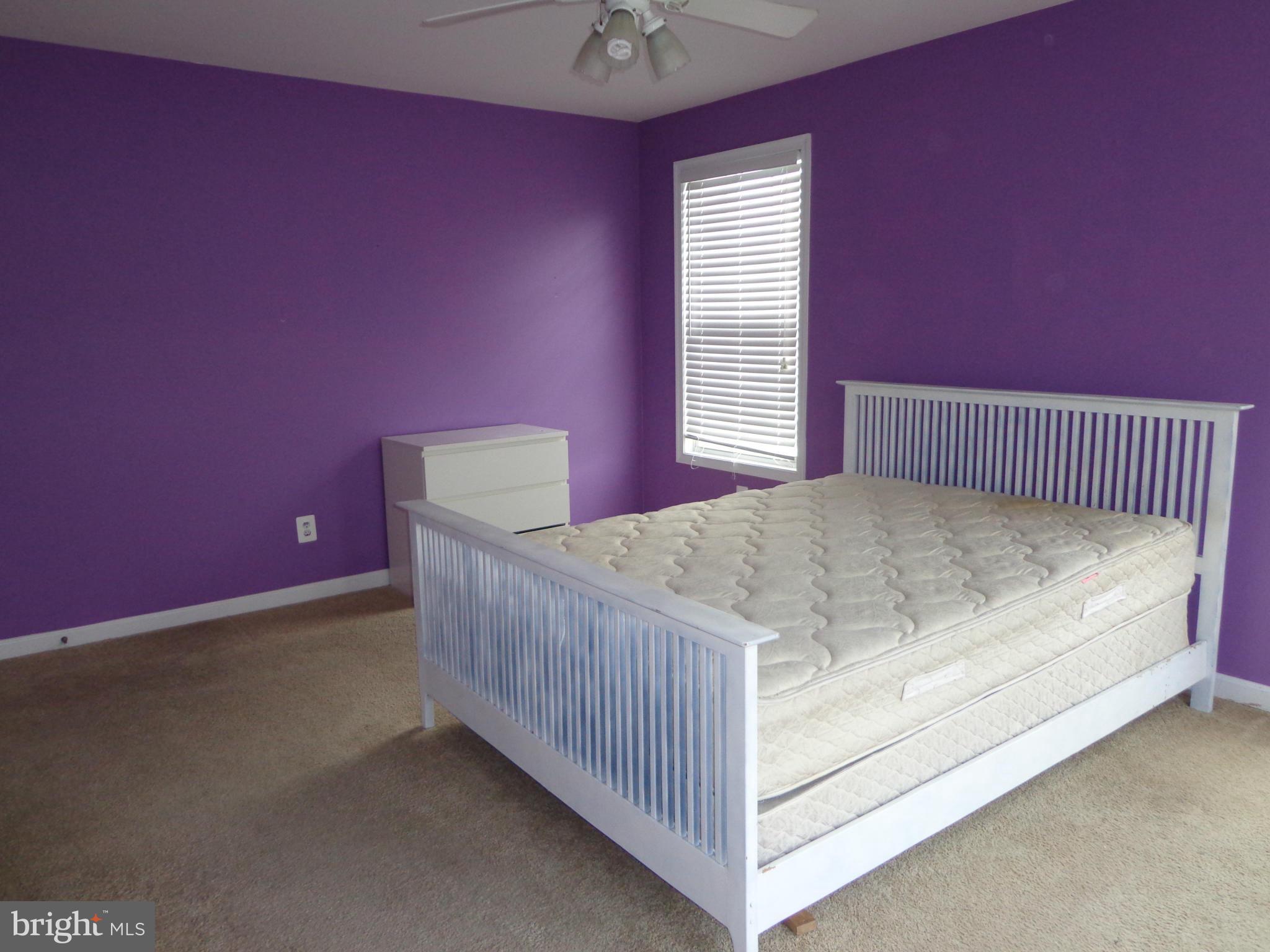 915 Oakdene Road Baltimore, MD 21220 - Photo 17 of 30 a view of a bedroom with a bed and window