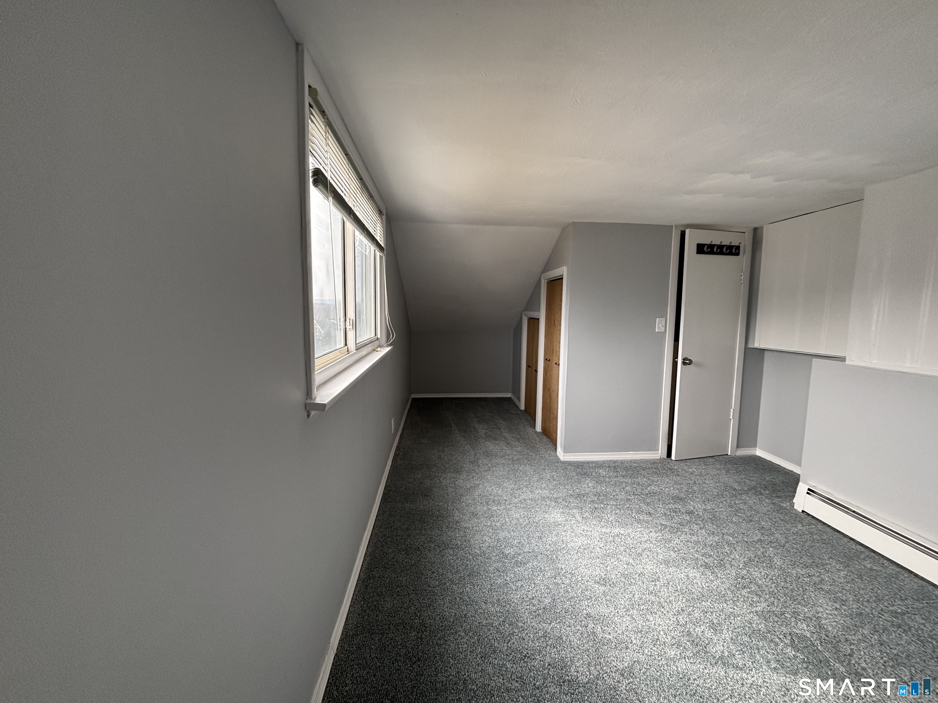 324 Savage Hill Road Berlin, CT 06037 - Photo 11 of 27 an empty room with windows and closet
