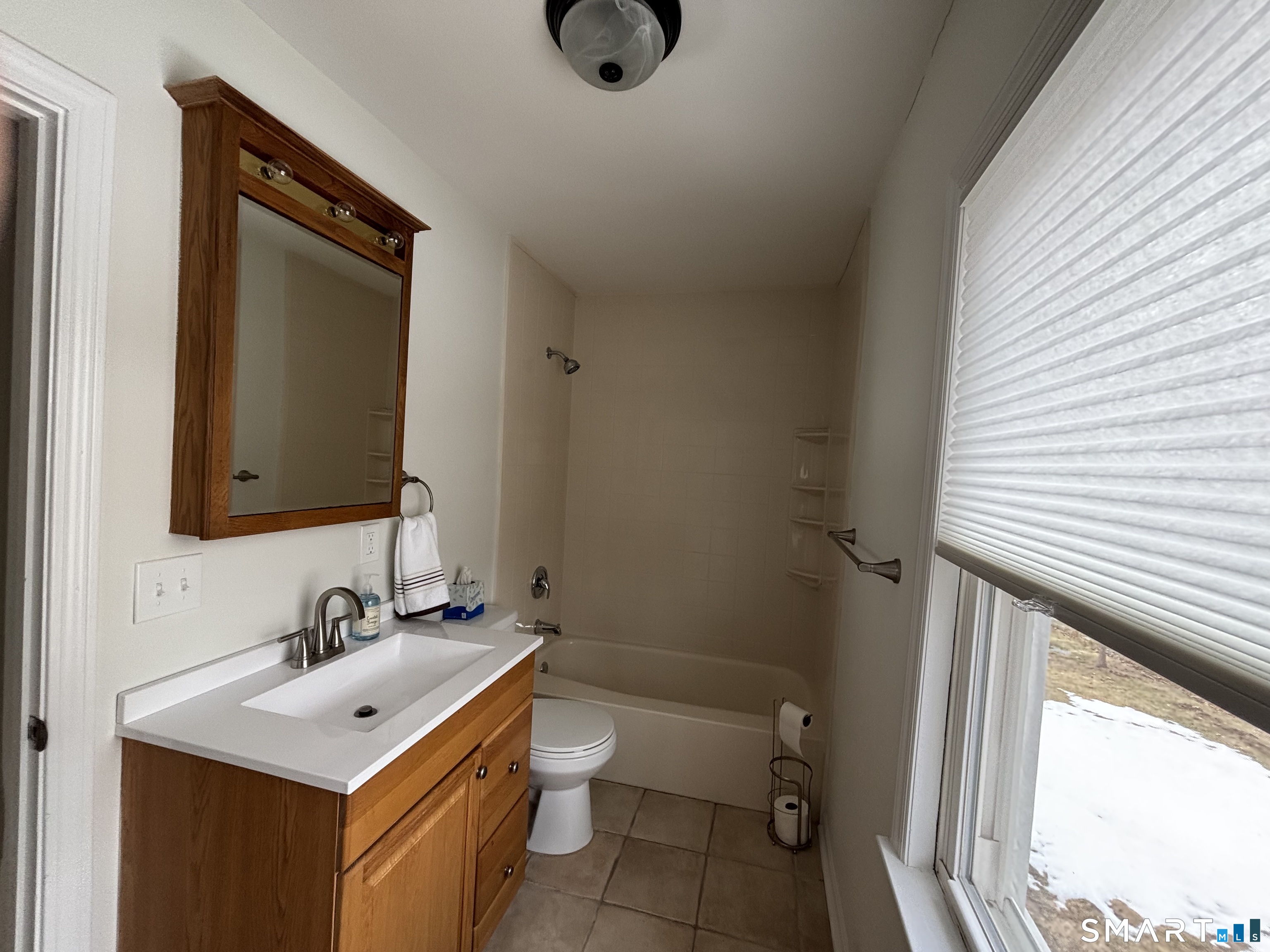 324 Savage Hill Road Berlin, CT 06037 - Photo 14 of 27 a bathroom with a sink toilet and vanity