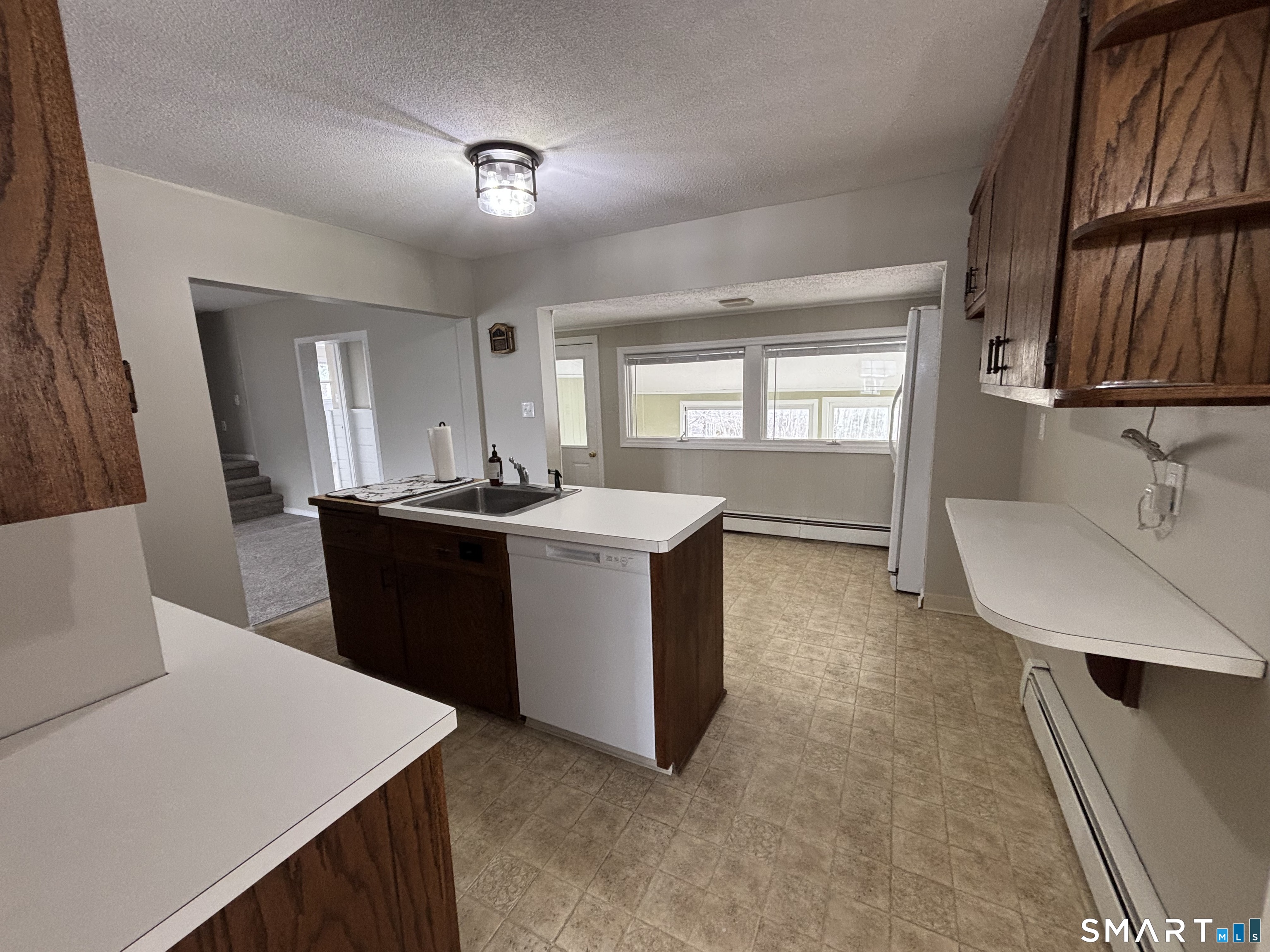 324 Savage Hill Road Berlin, CT 06037 - Photo 19 of 27 a kitchen with a sink a counter top space and appliances