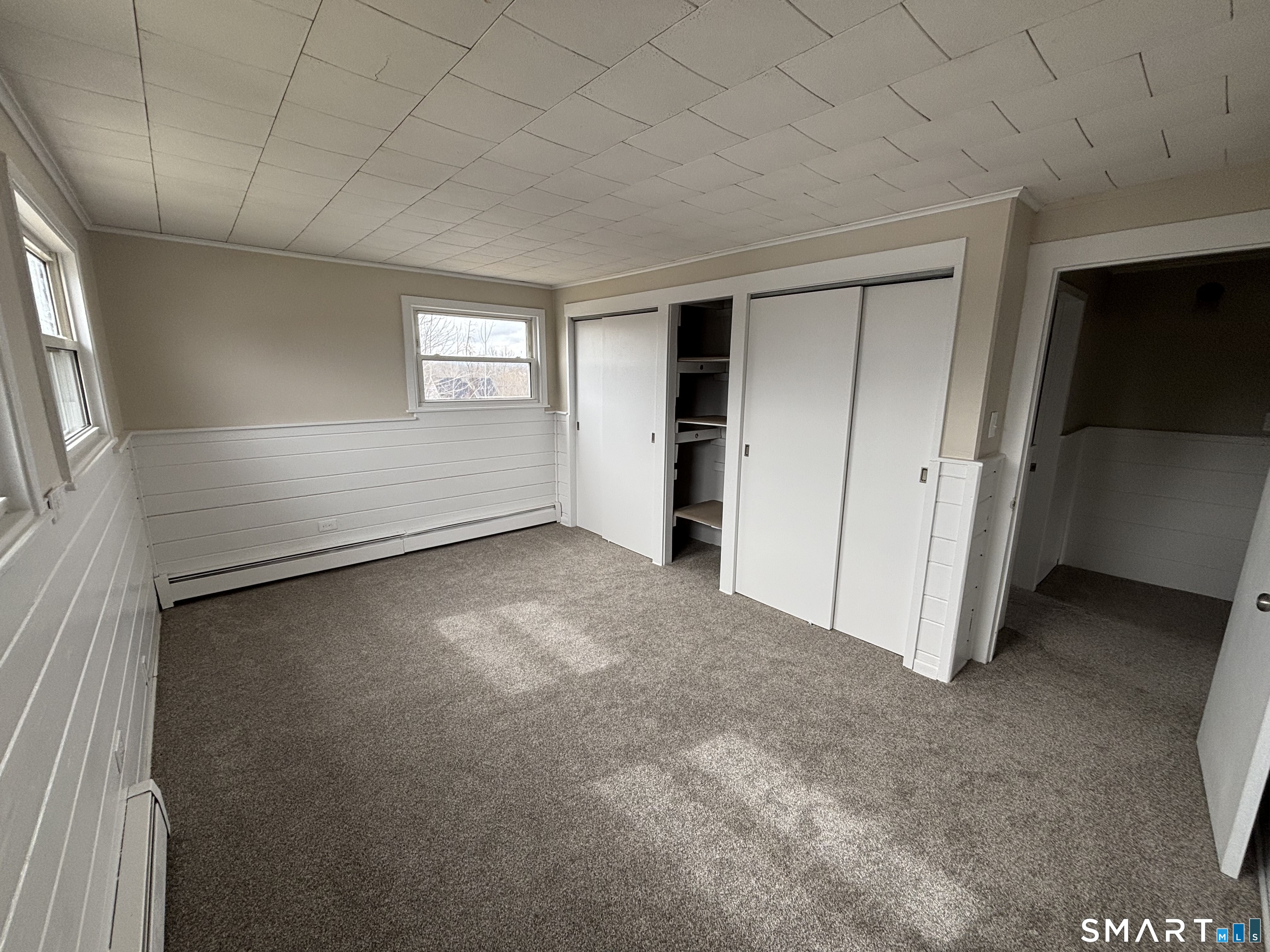 324 Savage Hill Road Berlin, CT 06037 - Photo 5 of 27 an empty room with windows