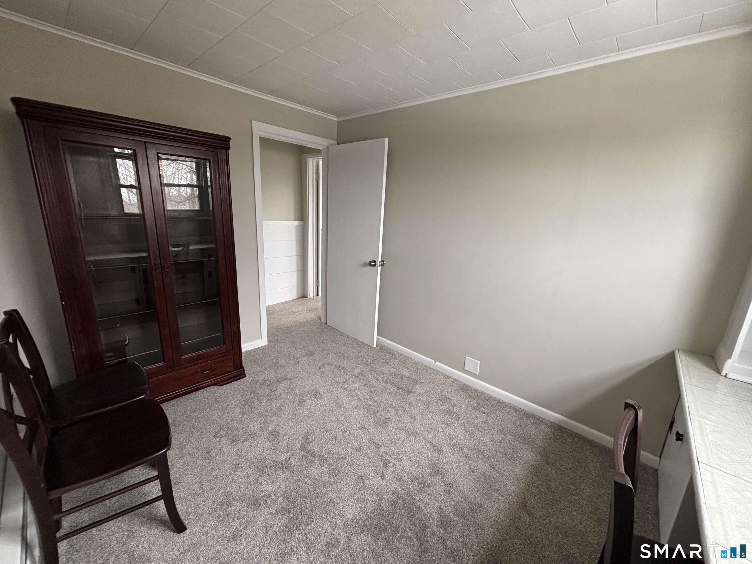 324 Savage Hill Road Berlin, CT 06037 - Photo 6 of 27 a view of an empty room with wooden floor and a window