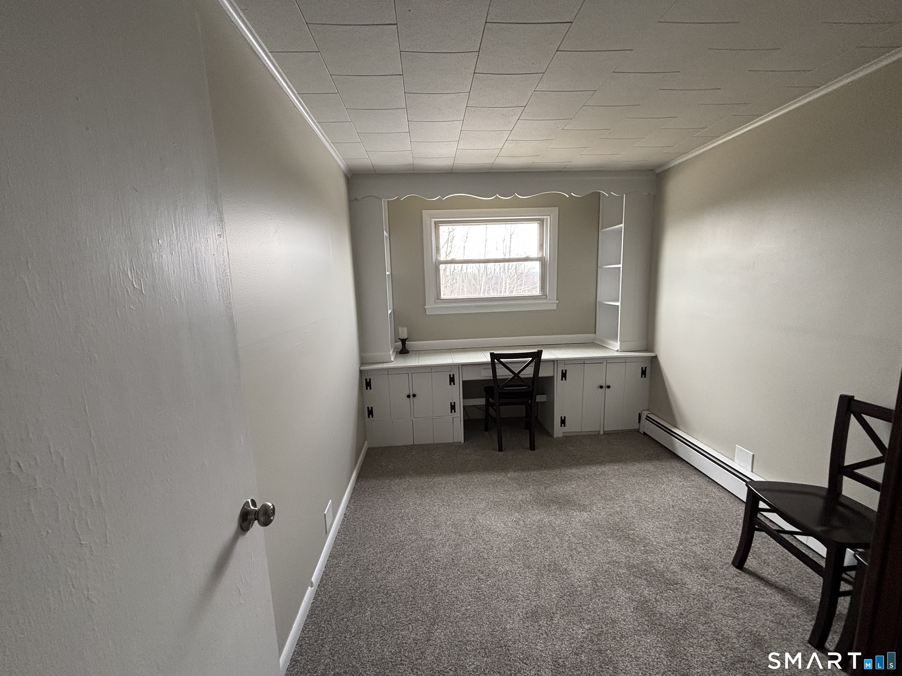 324 Savage Hill Road Berlin, CT 06037 - Photo 7 of 27 a view of a workspace with furniture and a window