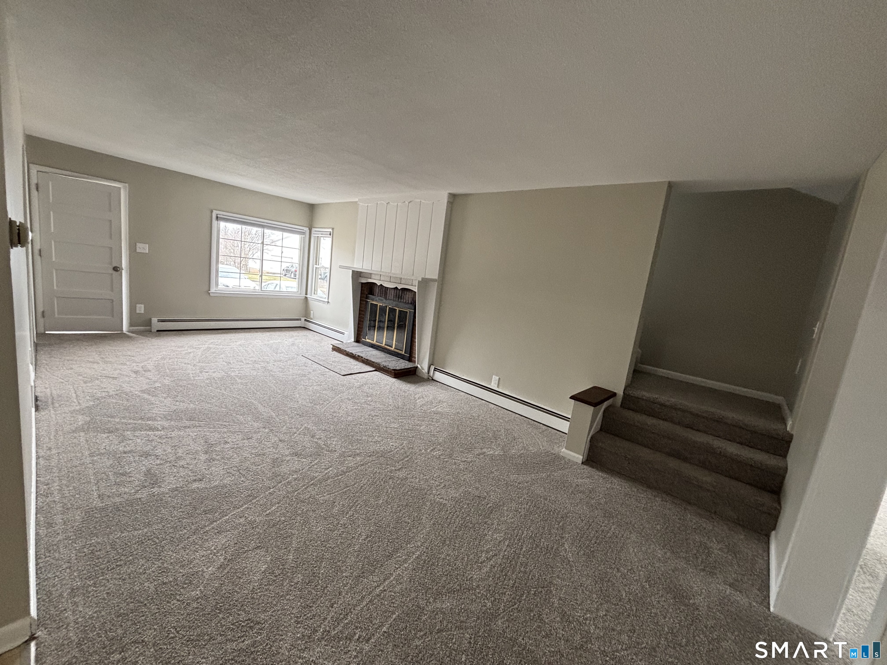 324 Savage Hill Road Berlin, CT 06037 - Photo 8 of 27 a view of a room with an empty space and a window