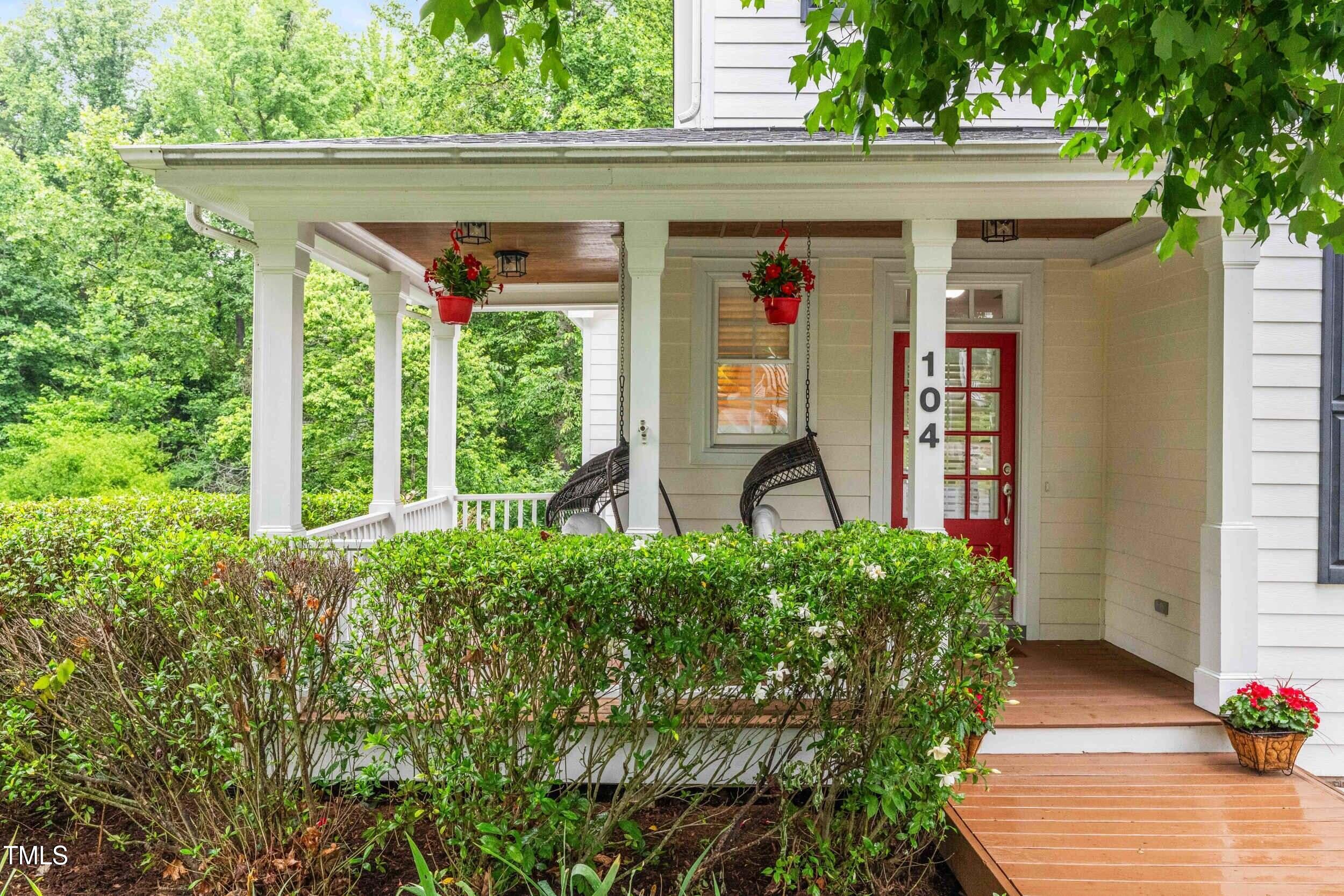 104 Edgewater Circle Chapel Hill, NC 27516 - Photo 1 of 4 a front view of a house with garden