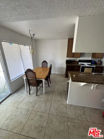 a living room with a table and chairs