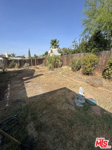 a view of a street with a yard